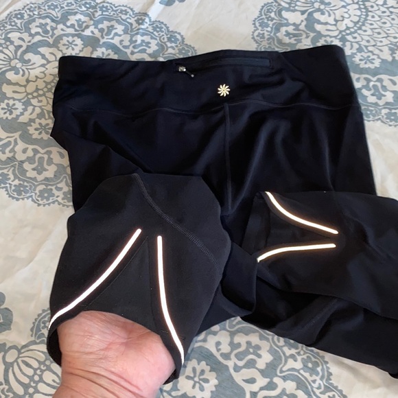 ATHLETA 22” Crop Training/running leggings with night reflective detailing trim. - Picture 11 of 12